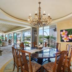 Tropical Dining Room With Pink Flower Art