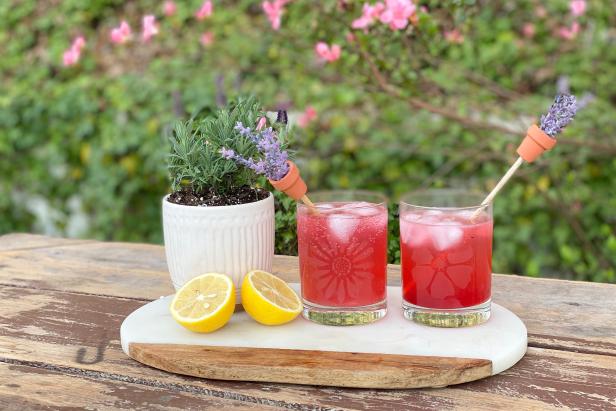 Make a Lavender Collins by adding 1-1/2 ounces of gin, 3/4 ounces fresh lemon juice, 1/2 ounces lavender and blackberry simple syrup and 3 ounces of club soda. Top with ice and garnish with lavender sprigs.