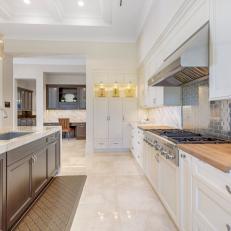 White Transitional Chef Kitchen With Butcher Block Counters
