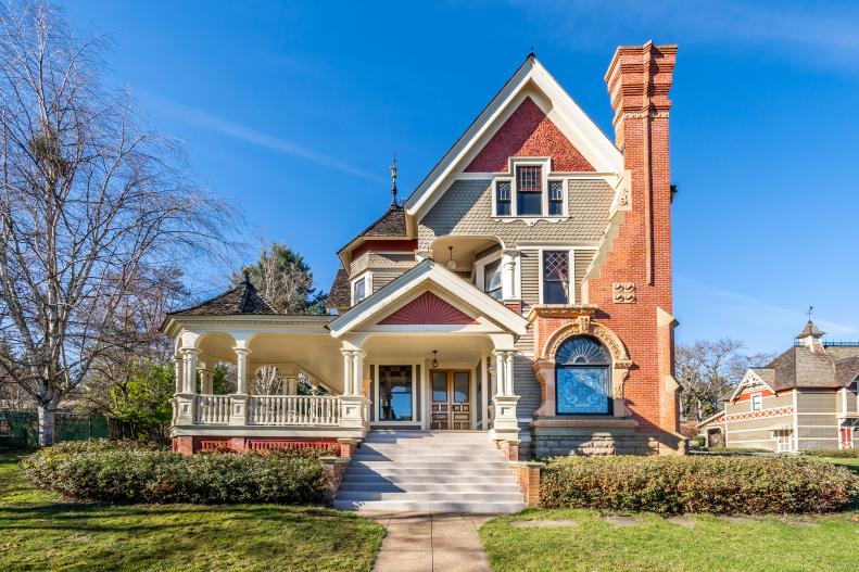 Victorian-Style Home With Covered Porch and Brick Accents
