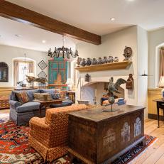 Living Room With an Exposed Wood Beam and Antique Furnishings 