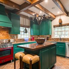 Rustic Kitchen Features Green Cabinets and Exposed Beams