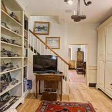 Hallway Features Built-in Bookshelves and a Variety of Antique Accents