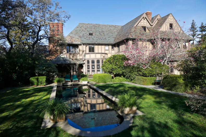 Tudor-Style Home With a Pool and Lush Landscaping