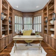 Traditional Study Features Built-In Bookshelves and a Bay Window