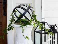 Follow our instructions to upcycle inexpensive metal hanging planters into a gorgeous, cottage-style topiary base for your favorite climbing vine or flower.