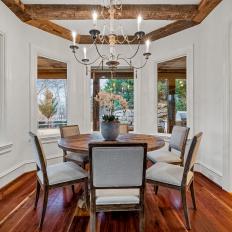 Hand-Hewn Beams and Iron Chandelier for Contemporary Breakfast Area