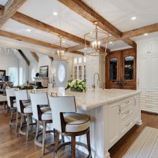 Hand-Hewn Beams and Hardwood Floors in Transitional Kitchen
