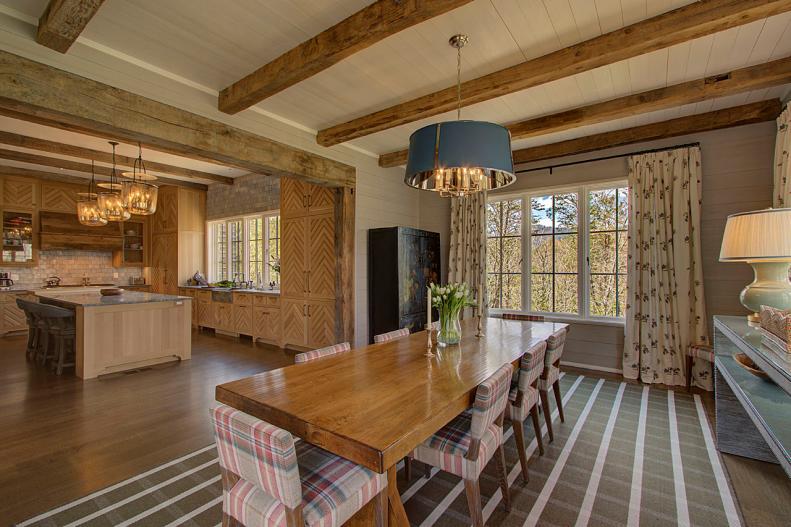 Exposed Beams, Open Dining Room Near Kitchen, Eight Chairs at Table