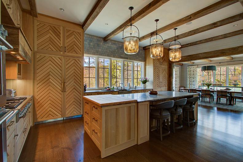 Exposed Wood Beams in Kitchen, Island with Seating, Steps to Dining