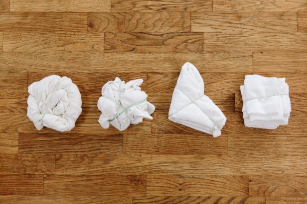 Four Rolled and Folded Napkins on Table Before Tie-Dye Color Added