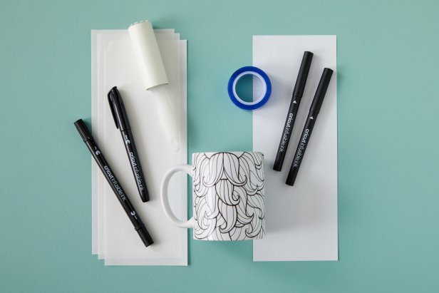 Cricut mugs can be made with Infusible Ink pens, copy paper, and heat-resistant tape.