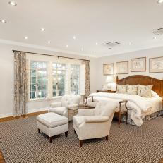 Traditional Bedroom With White Armchairs