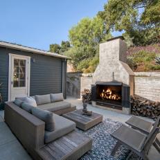 Outdoor Fireplace Warms Patio Living Area