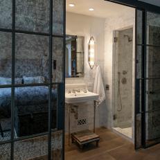 Mercury Glass Wall Hides Elegant Ensuite Bathroom