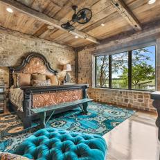 Rustic Bedroom With Blue Rug