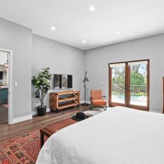 Bohemian Bedroom With Orange Rug