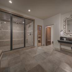 Gray Bathroom With Ornate Mirror