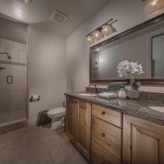 Gray Bathroom With White Orchid