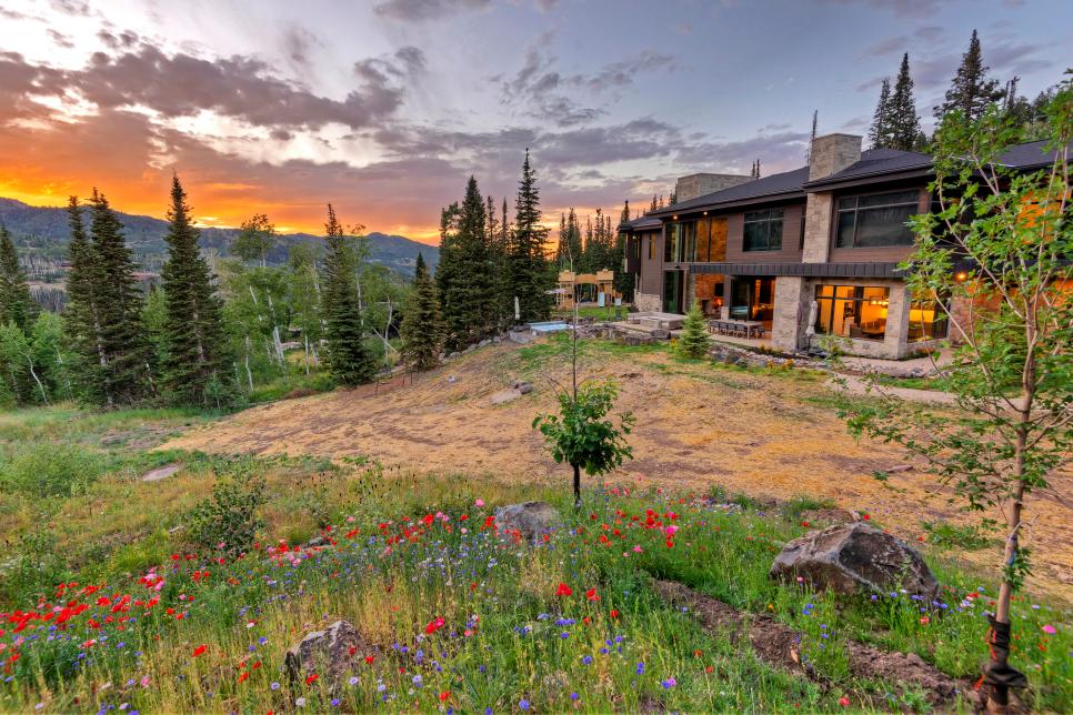 Sun Sets on Modern Mountain Home Exterior, Wildflowers in Yard