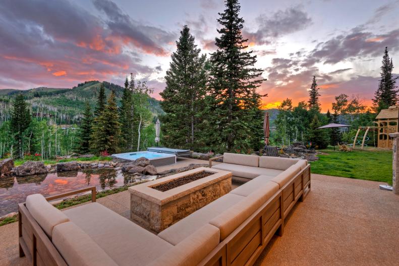 Modern Fire Pit, Sectional Outdoor Sofa Beside Hot Tub and Rock Pond