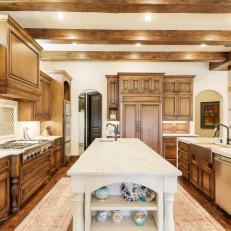 Chef's Kitchen With Custom Wood Cabinetry and Quartzite Islands