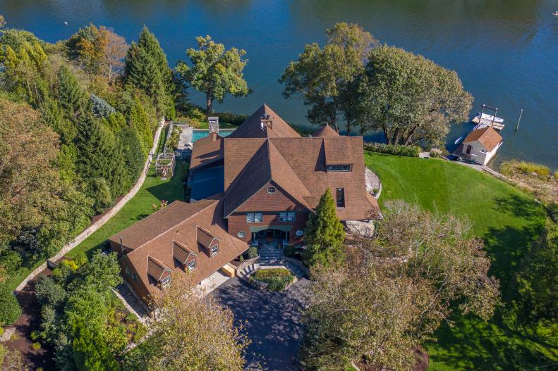 Aerial of Waterfront Property with Boathouse, Driveway, Dock, Garage