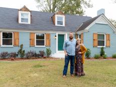 As seen on Home Town Takeover, Ben and Erin Napier pose in front of the Moody's house.
