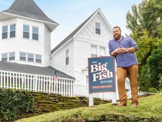 As seen on Home Town Takeover, Ben Napier poses outside The Big Fish House.