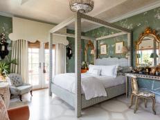 Designers poured attention into ceilings and floors in this show home, including Westchester-based Brittany Bromley of Brittany Bromley Interiors who mixed French and Palm Beach flourishes in this bedroom. 

A hand-painted floor and hand-painted, scenic wallpaper show the influence of bespoke touches and botanicals in home design. Intricate cornices in a scalloped design suggest traditional European style window treatments. 