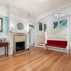 Traditional Foyer With Red Bench