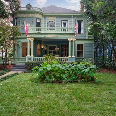 Blue and Green Colonial Revival Exterior With Flags