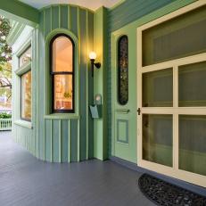 Green and Blue Front Porch With Yellow Front Door