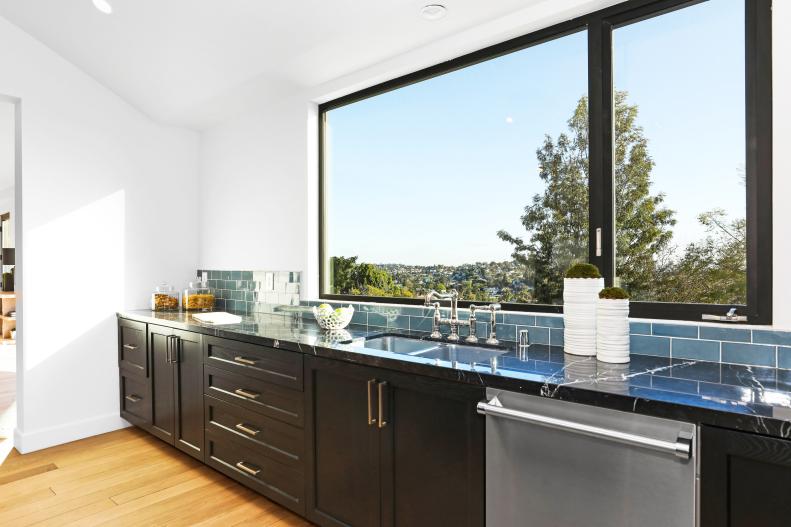 Big Windows Above Sink in Modern Chef's Kitchen, Blue Tile Backsplash