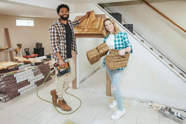 As seen on Hot Mess House, professional organizer Cas Aarseen and her co-host Wendell Holland worked to build a combination home office, play area and entertainment room in the basement of Chris and Christine Ziobro's New Jersey home. Wendell was installing the play room roof as Cas organized storage.