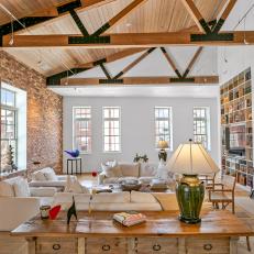 Great Room Features Vaulted Ceilings and Exposed Wood Beams