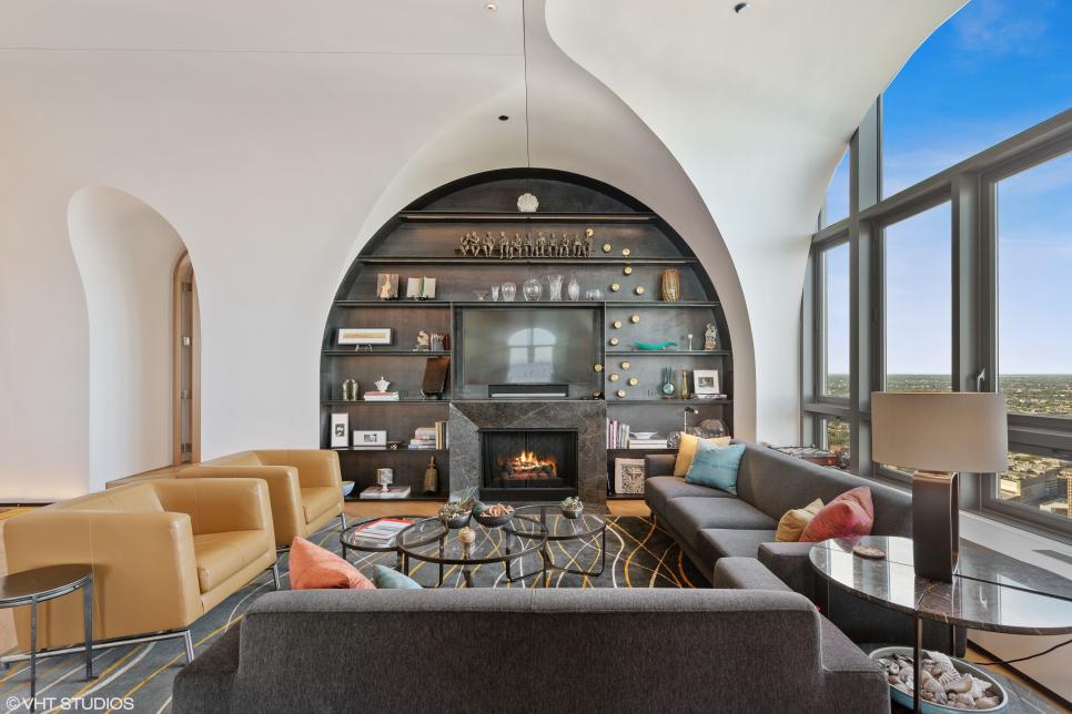 Living Room With Arched Built-In and a Large Window