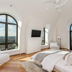 White Bedroom With Large Windows and a Platform Bed