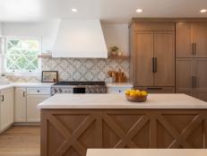 Warm Brown Cabinetry With Stainless Steel Stove