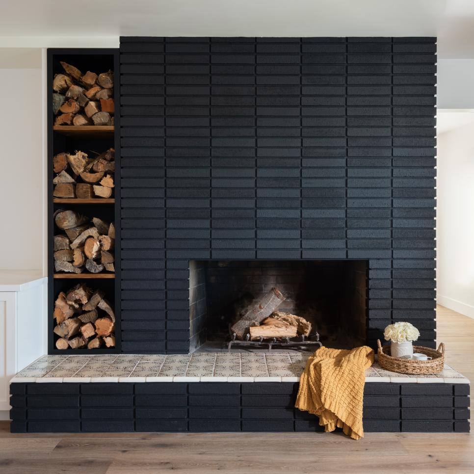 living room with brick fireplace