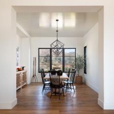 Contemporary Dining Room With Geometric Pendants