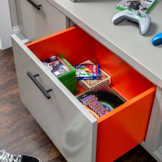 Gray and Orange Drawer With Games