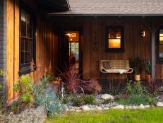 External shot of a home covered in natural redwood siding.