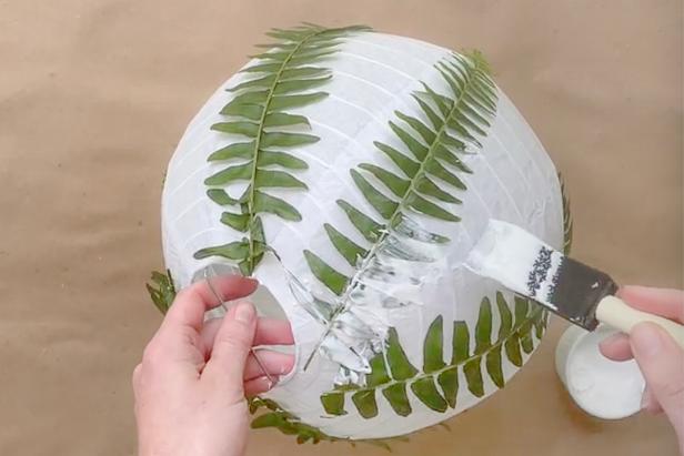 Add decoupage glue to the fern using a foam brush. Coat the entire fern sprig with glue. Then let dry overnight.