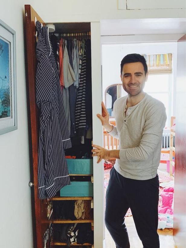 Tyler Moore, also known as the Tidy Dad, shows off his tiny, but tidy clothes closet.