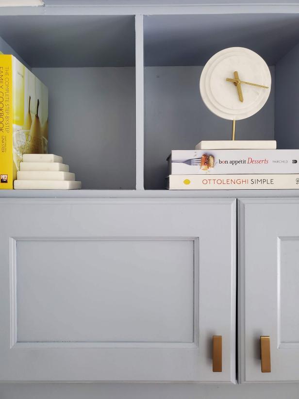 Blue Cabinet Shelf Housing Recipe Books and Decor