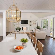 Contemporary White Kitchen Island With Stunning Brass Pendant Lights