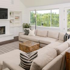 Contemporary Living Room With Warm Vanilla Couch and Lively Potted Plants