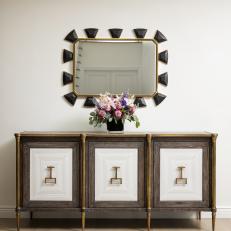 Black Geometric Mirror and Brown Cabinet