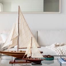 White Coastal Living Room With Model Sailboat